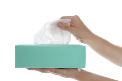 Photo of Woman taking paper tissue from box on white background, closeup