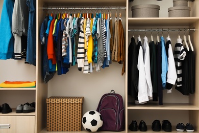 Photo of Large wardrobe with teenager clothes, shoes and accessories