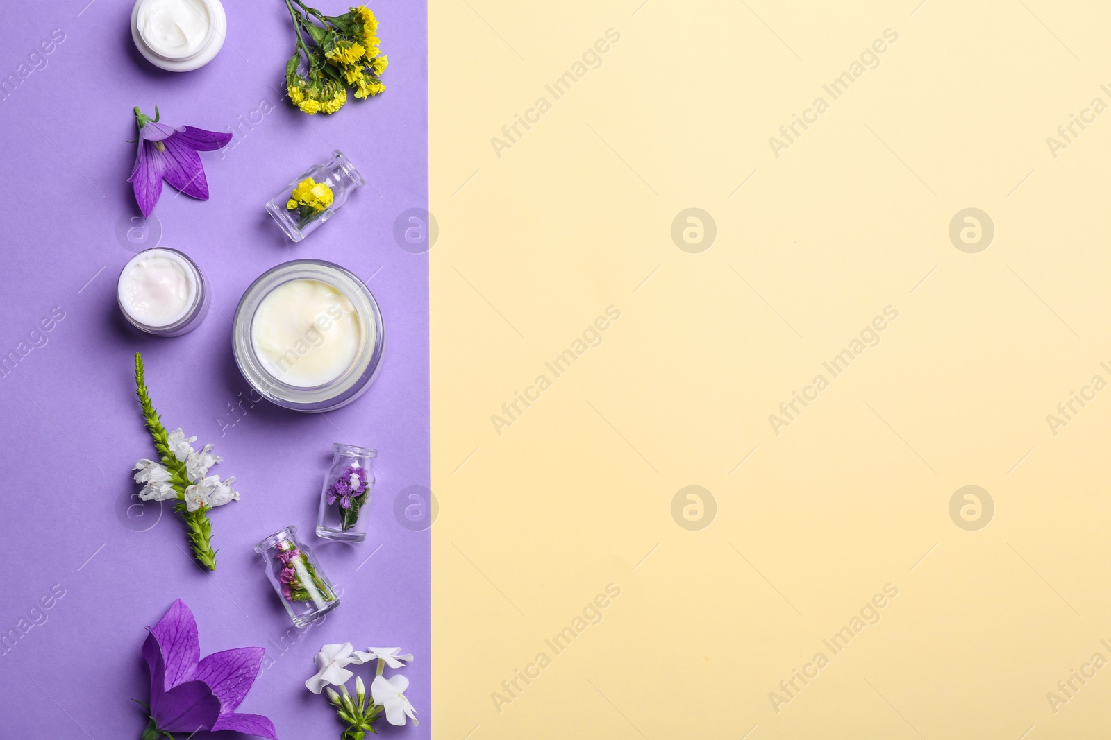 Photo of Flat lay composition with jars of body cream on color background. Space for text