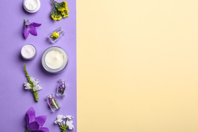 Photo of Flat lay composition with jars of body cream on color background. Space for text