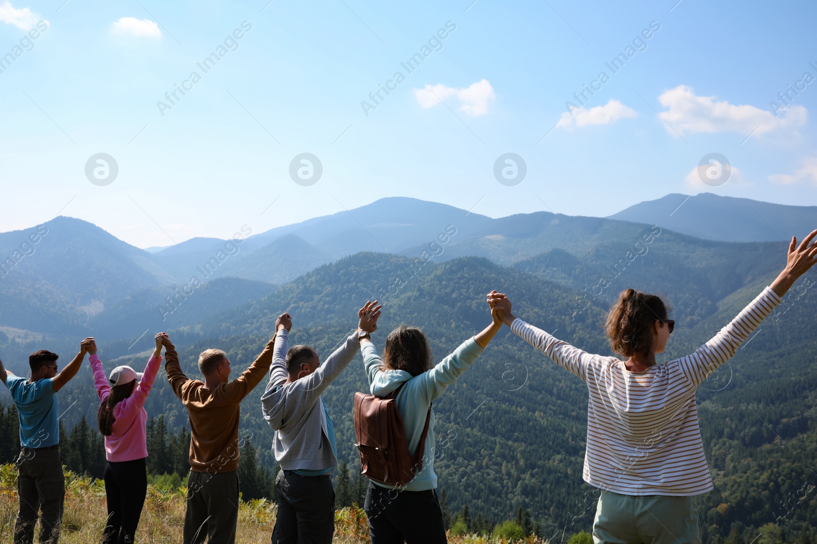 Photo of Group of people spending time together in mountains