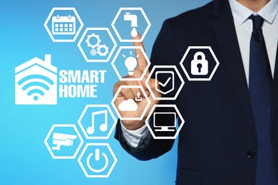 Image of Man using digital screen with Smart Home interface on light blue background, closeup