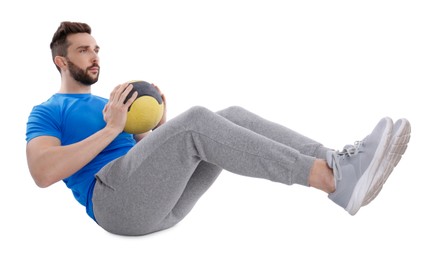 Athletic man doing exercise with medicine ball isolated on white