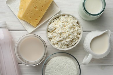 Photo of Lactose free dairy products on white wooden table, flat lay