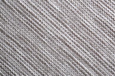 Photo of Beautiful grey knitted fabric as background, top view