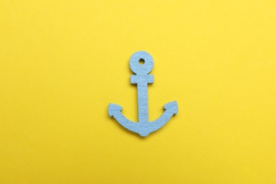 Anchor figure on yellow background, top view