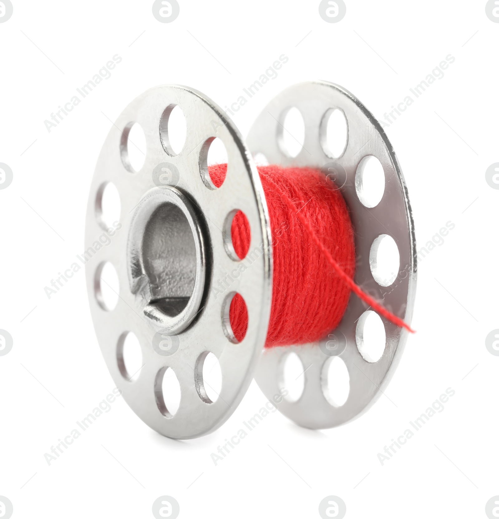 Photo of Metal spool of red sewing thread isolated on white