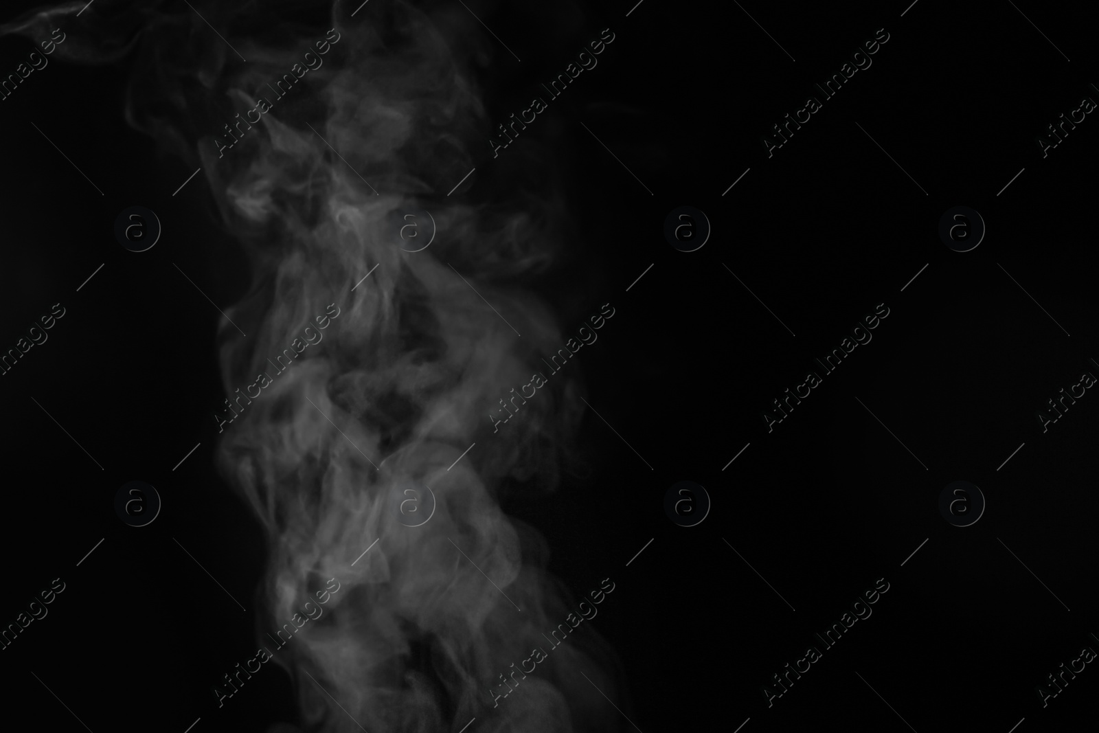 Photo of White steam in air against black background