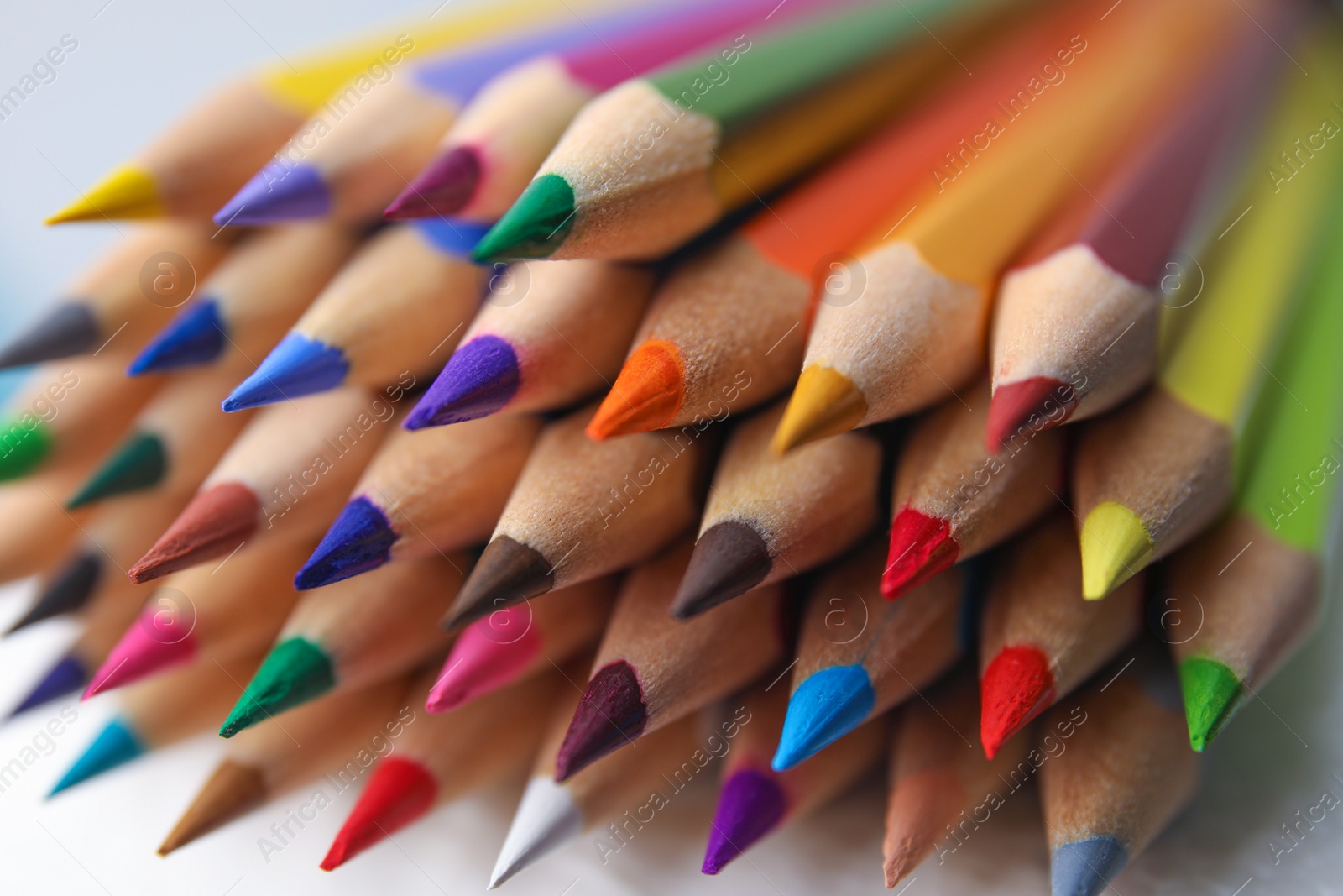 Photo of Many colorful wooden pencils on white background, closeup