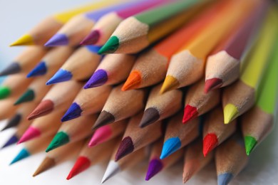 Photo of Many colorful wooden pencils on white background, closeup