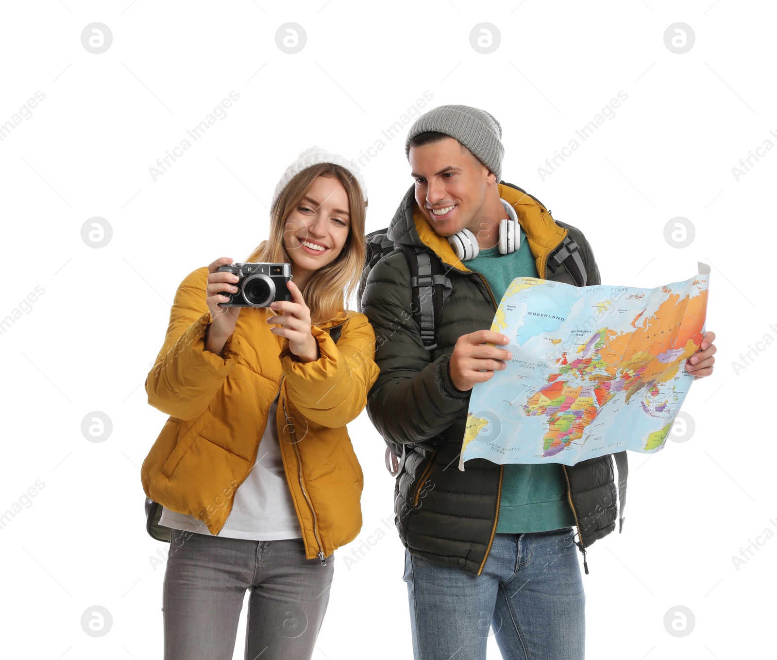 Photo of Couple with map and camera on white background. Winter travel