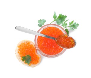 Photo of Delicious red caviar, tasty sandwich and parsley on white background, top view