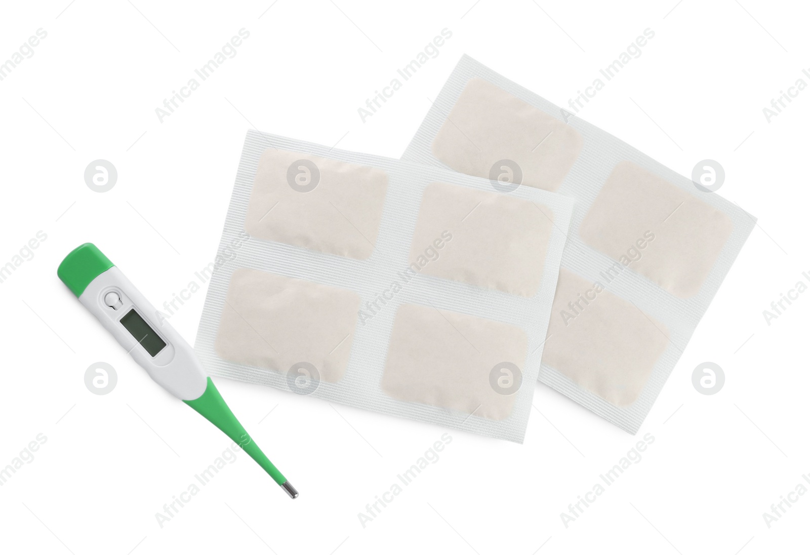 Photo of Mustard plasters and thermometer on white background, top view