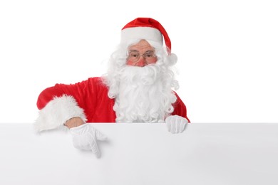 Photo of Man in Santa Claus costume posing and pointing on white background