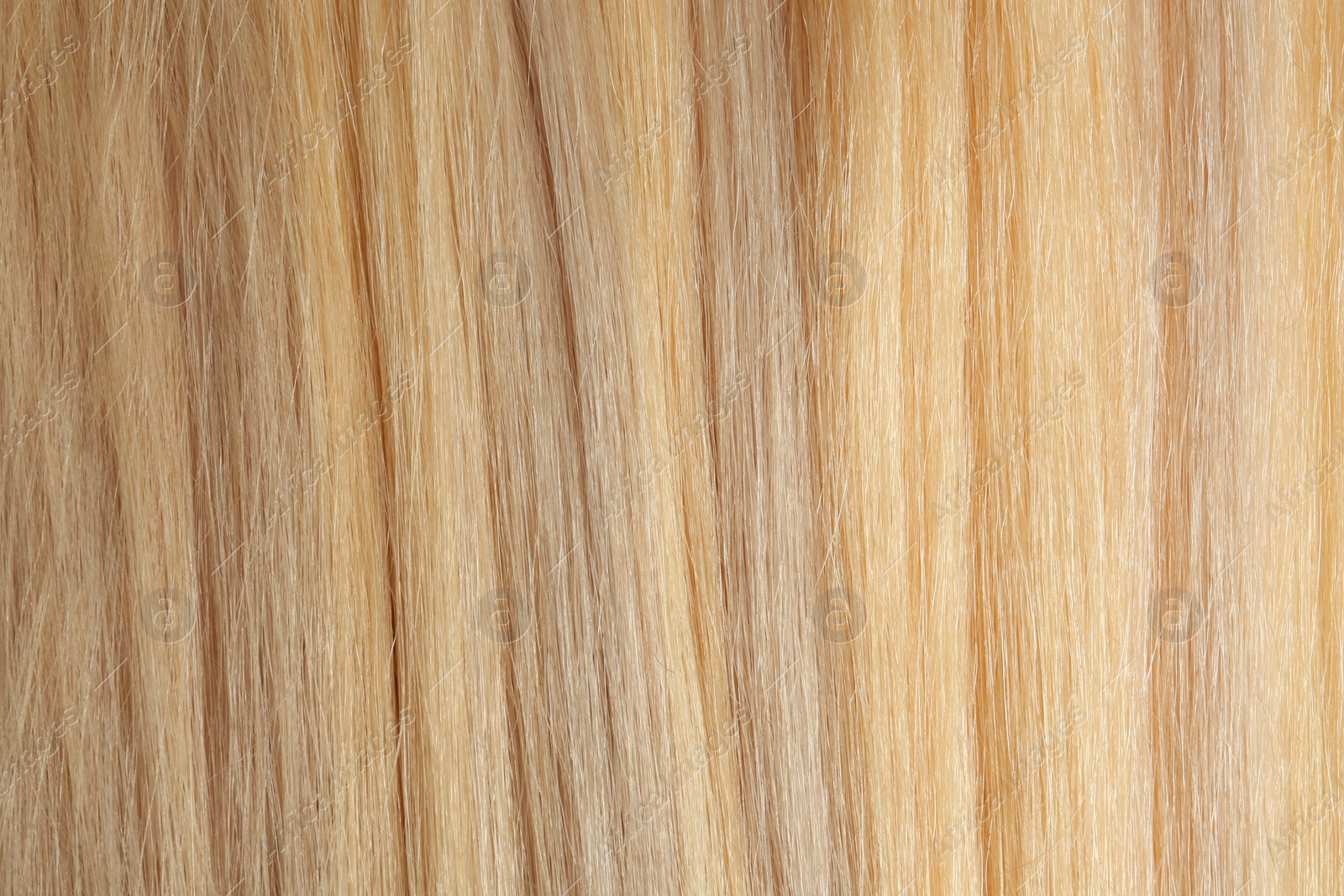 Photo of Texture of healthy blond hair as background, closeup