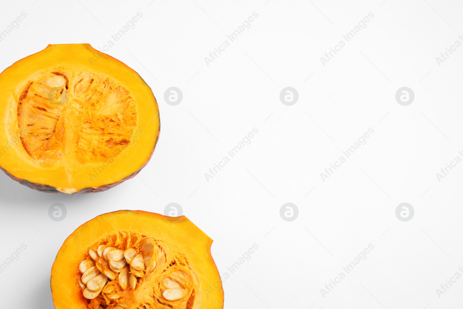 Photo of Fresh ripe pumpkins on white background, top view. Holiday decoration