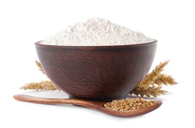 Photo of Organic flour in bowl, spoon with grains of wheat and spikelets on white background