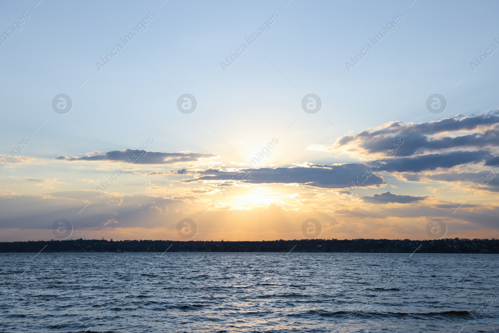 Photo of Picturesque view of tranquil river at sunset