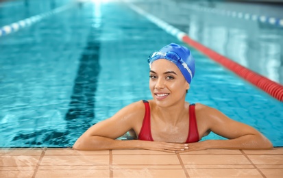 Photo of Young athletic woman in swimming pool
