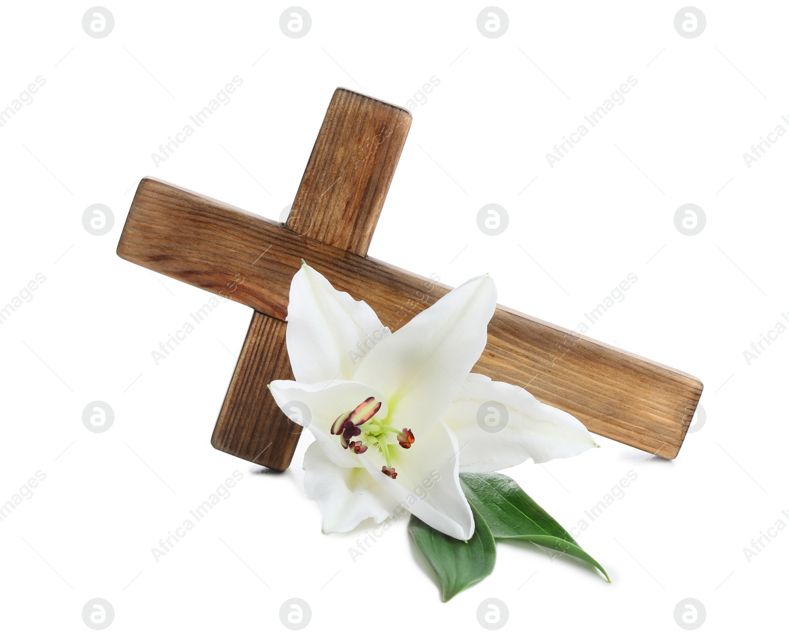 Photo of Wooden cross and blossom lily on white background