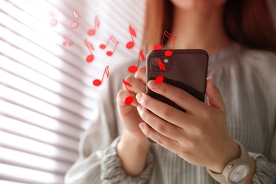 Image of Woman listening to music on mobile phone indoors, closeup. Music notes illustrations flowing from gadget