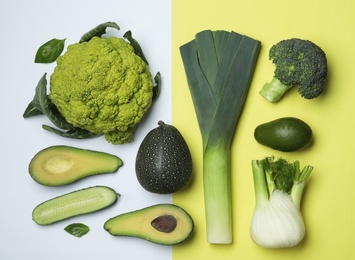 Photo of Flat lay composition with fresh ripe vegetables on color background