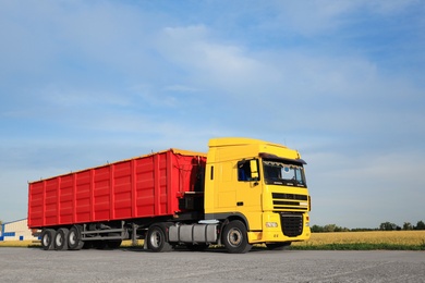 Modern bright truck parked on country road