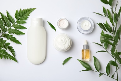 Flat lay composition with different body care products on white background