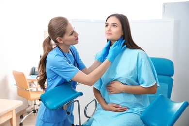 Photo of Pregnant woman having appointment at gynecologist office