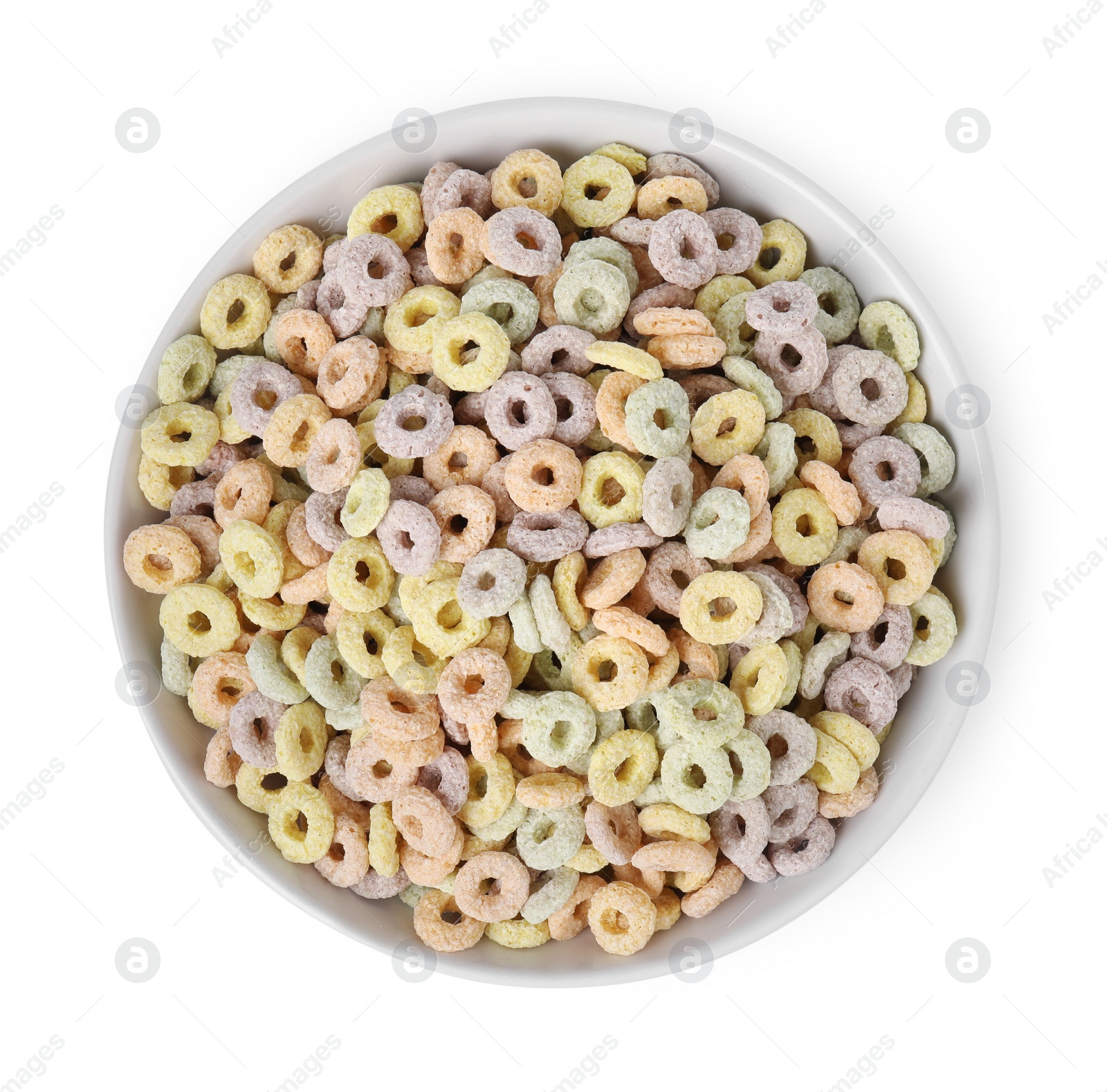 Photo of Tasty cereal rings in bowl isolated on white, top view