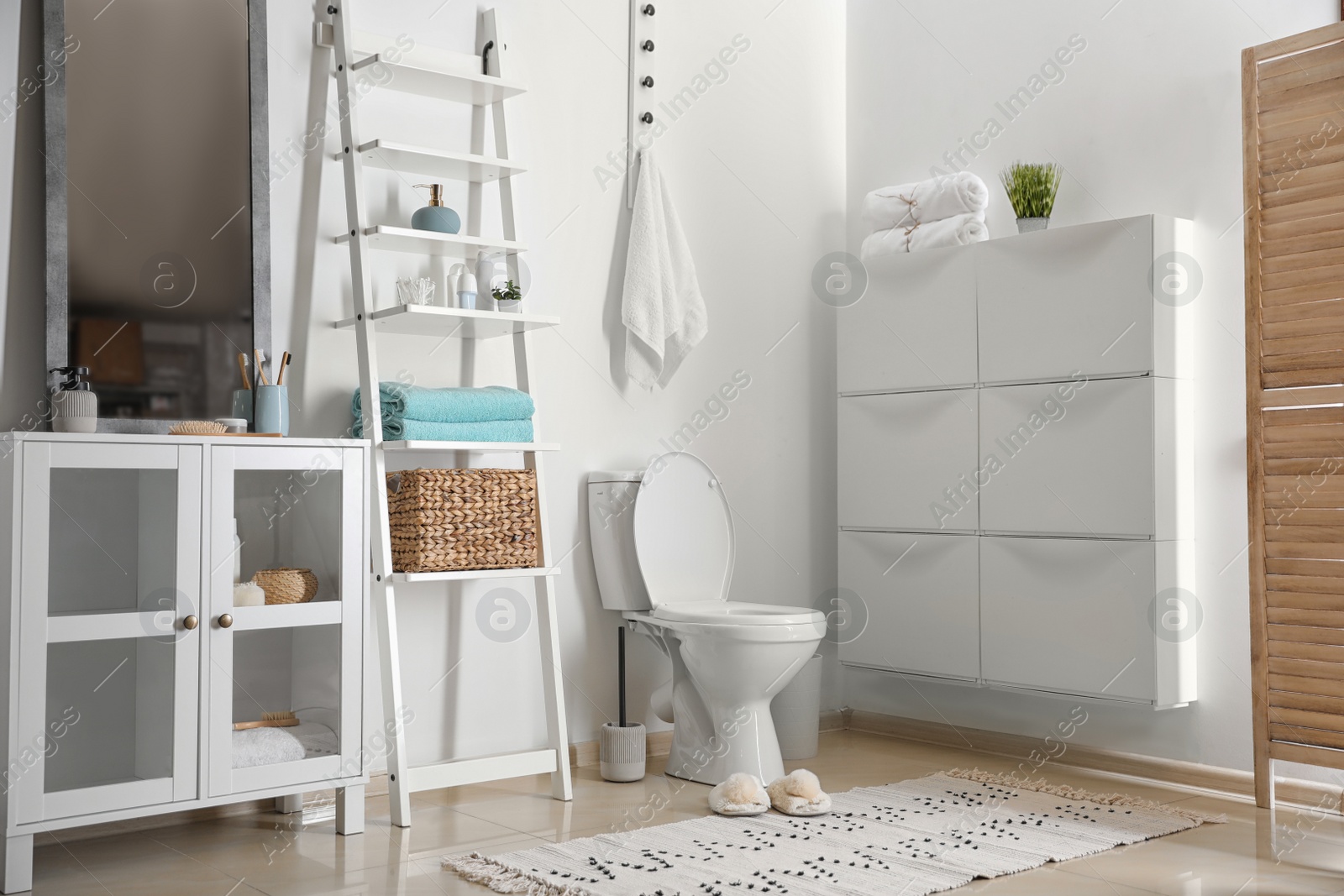 Photo of Interior of stylish bathroom with toilet bowl