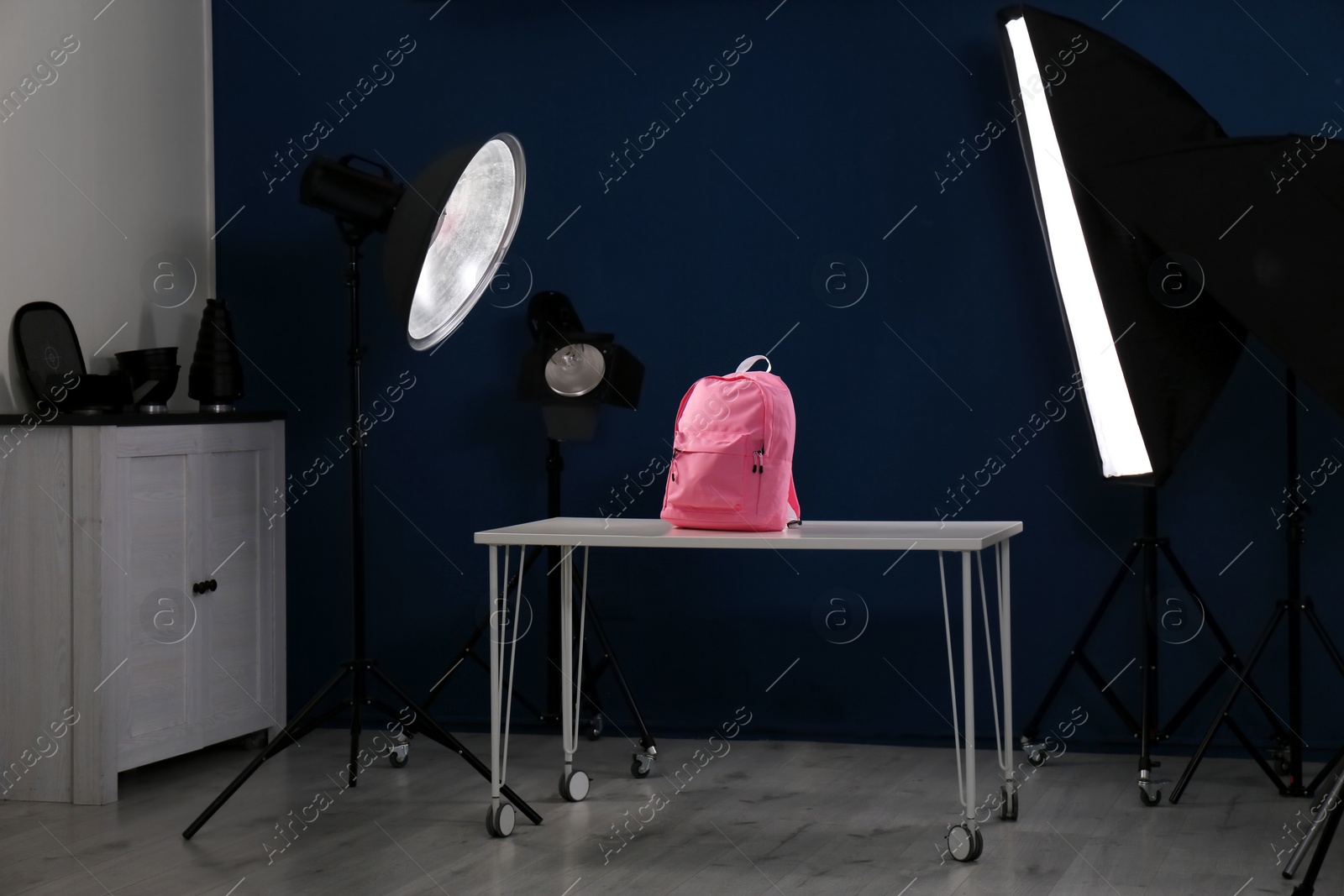 Photo of Shooting of bright backpack for product promotion in photo studio