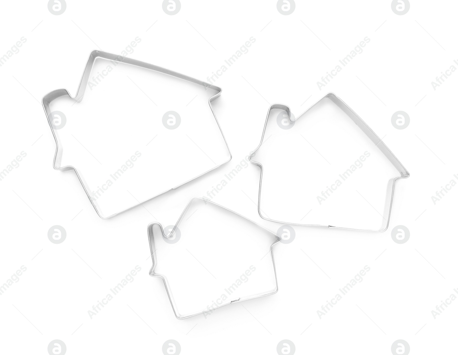 Photo of House shaped cookie cutters on white background, top view