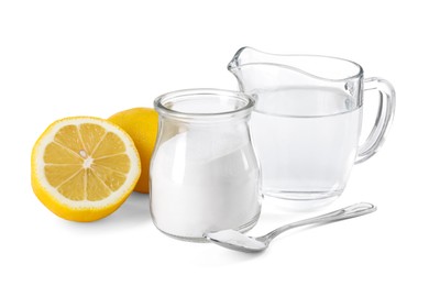 Photo of Baking soda in jar, vinegar and lemons isolated on white