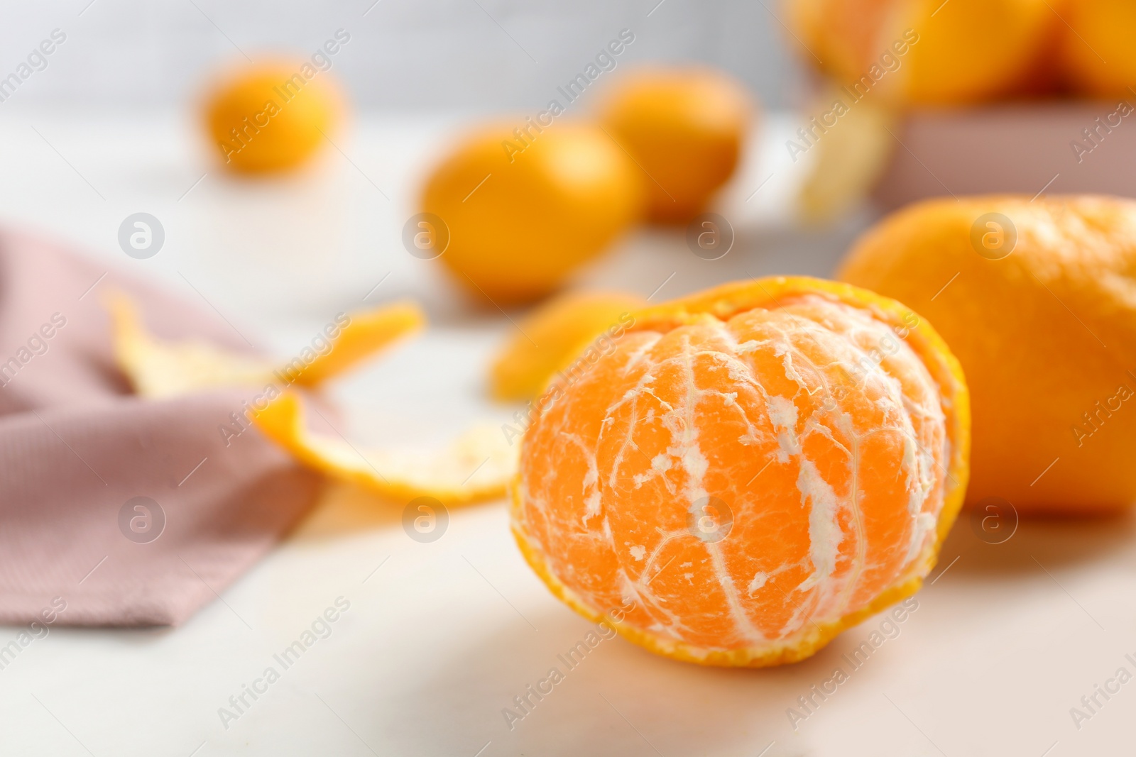 Photo of Fresh tangerines on white table. Citrus fruit