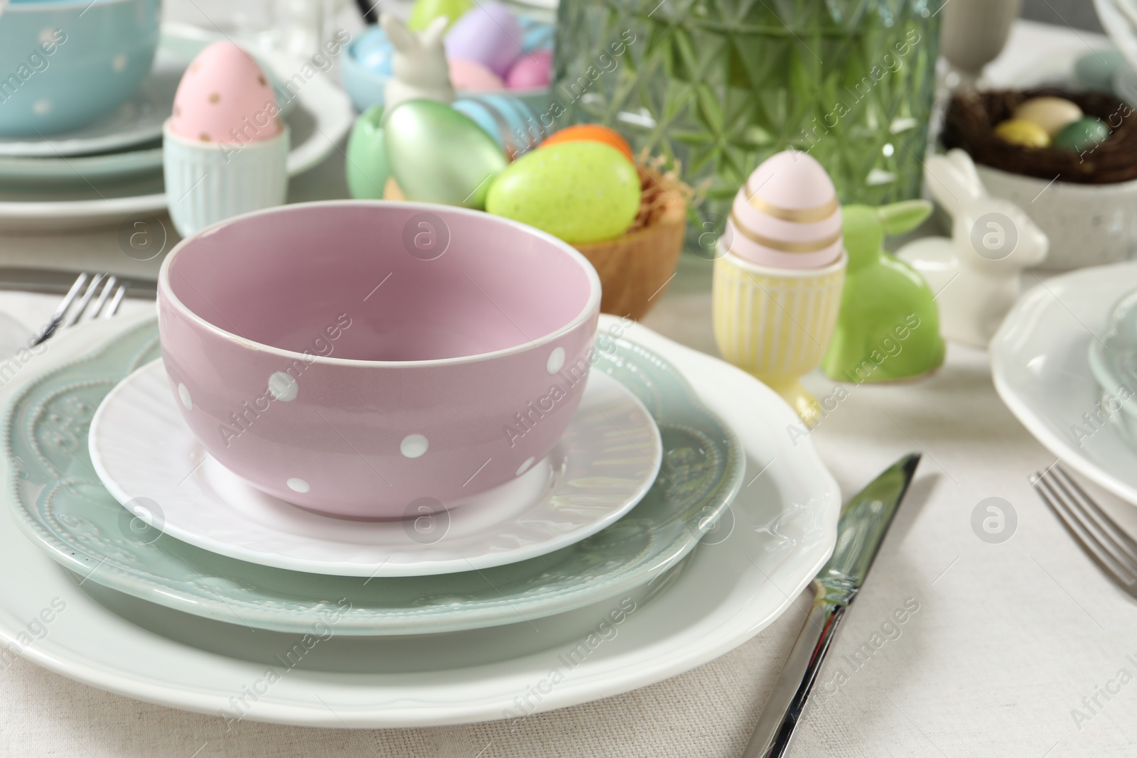 Photo of Easter celebration. Festive table setting with painted eggs.