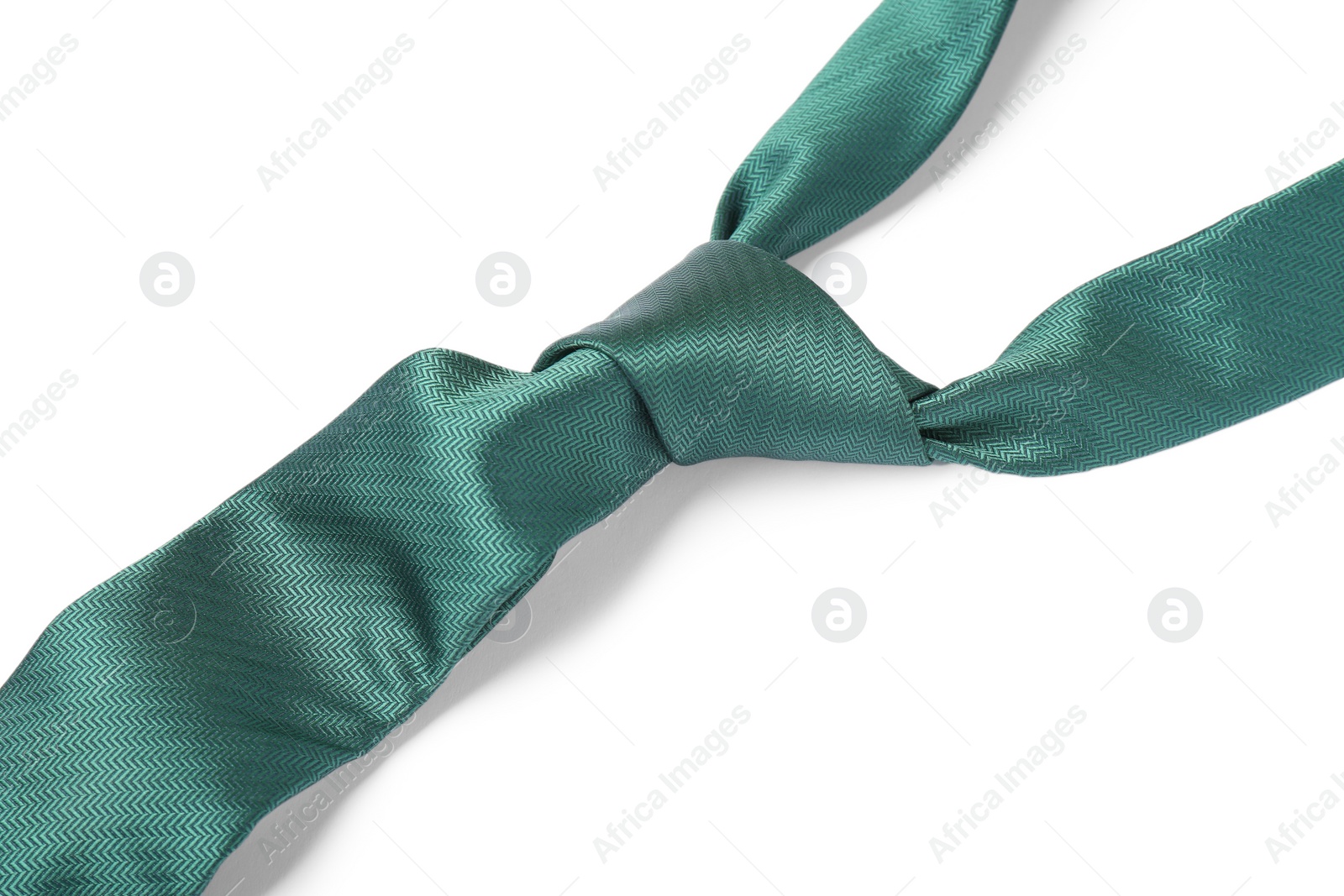 Photo of Green male tie isolated on white, closeup