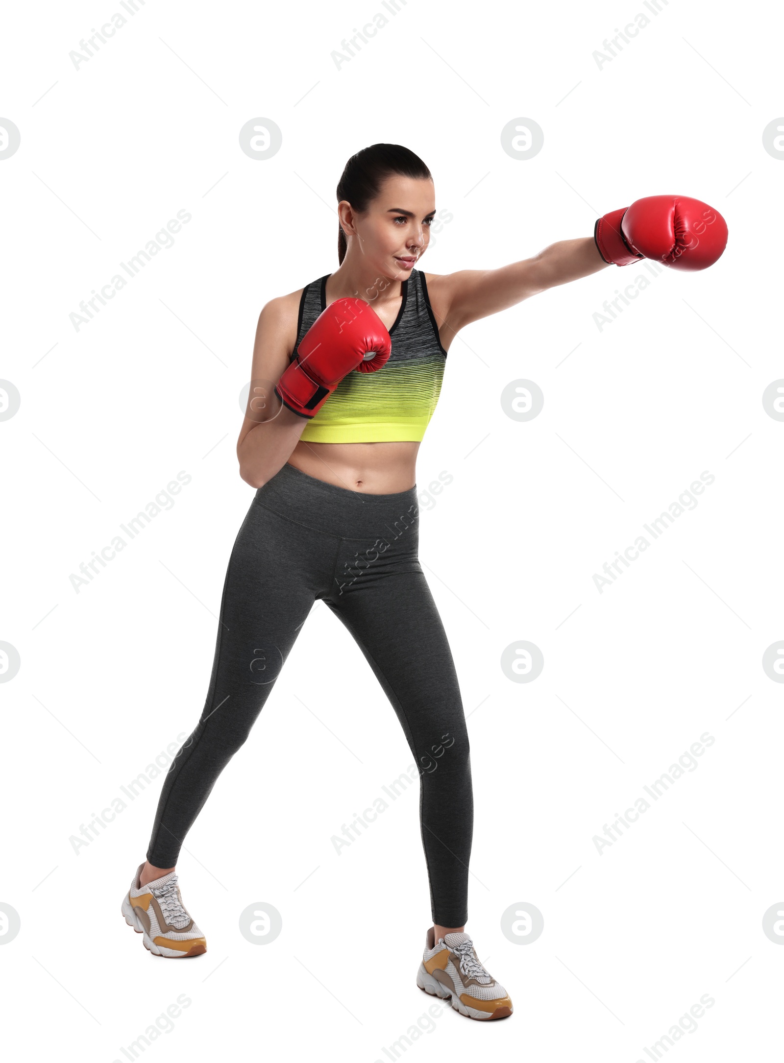 Photo of Beautiful woman in boxing gloves training on white background