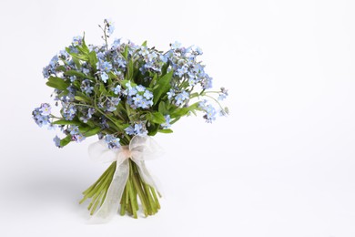Bouquet of beautiful forget-me-not flowers on white background, space for text