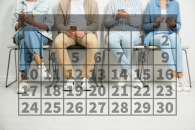 Calendar and people with modern smartphones indoors, closeup