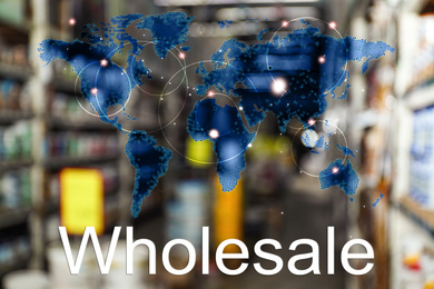 Wholesale business. World map and blurred view of warehouse on background