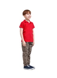 Photo of Little boy in red polo shirt and beige pants on white background