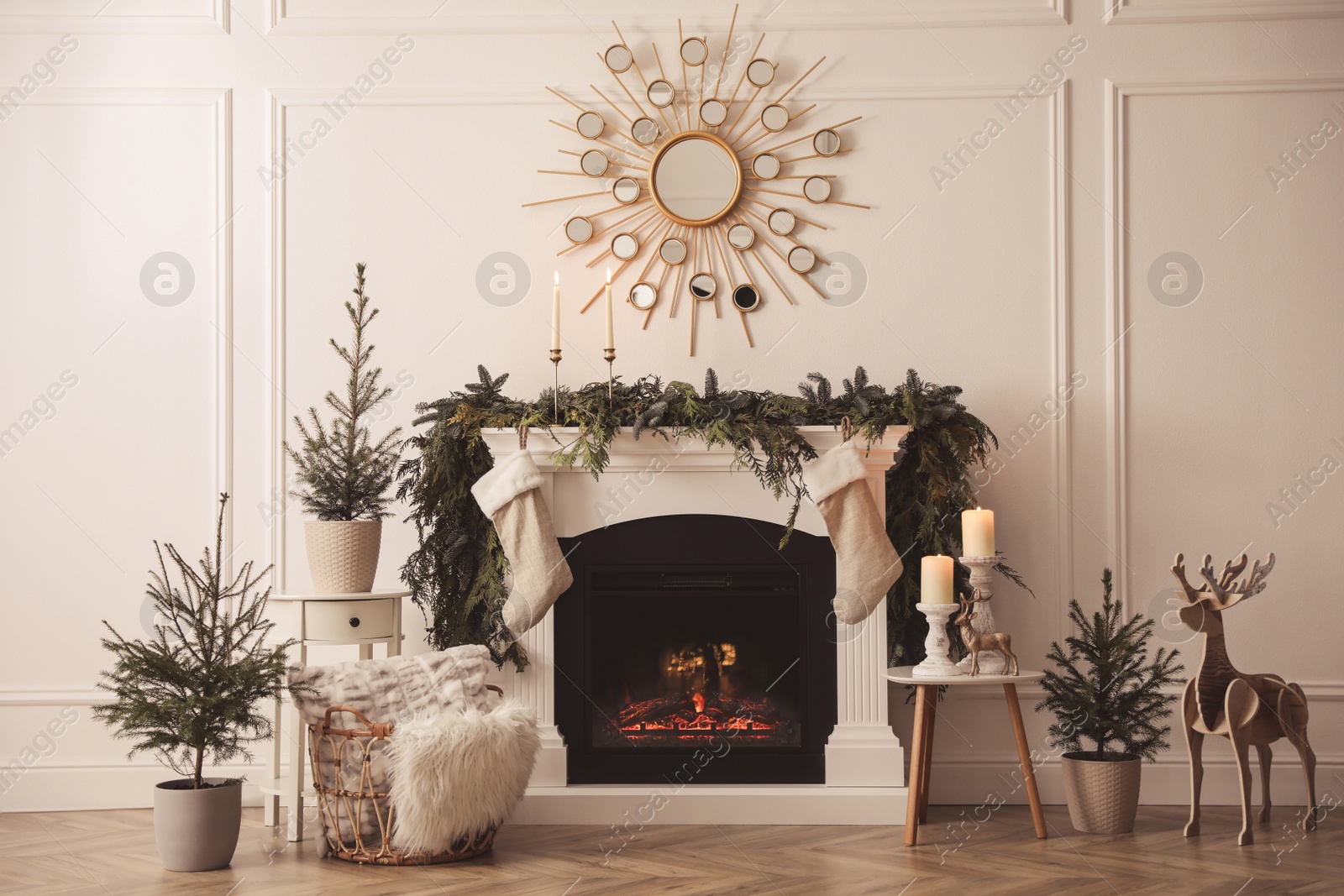 Photo of Stylish room interior with fireplace and beautiful Christmas decor