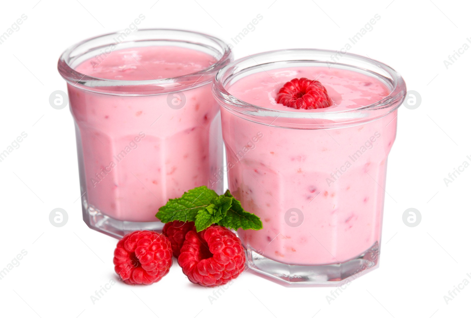 Photo of Tasty fresh raspberry smoothie in glasses on white background