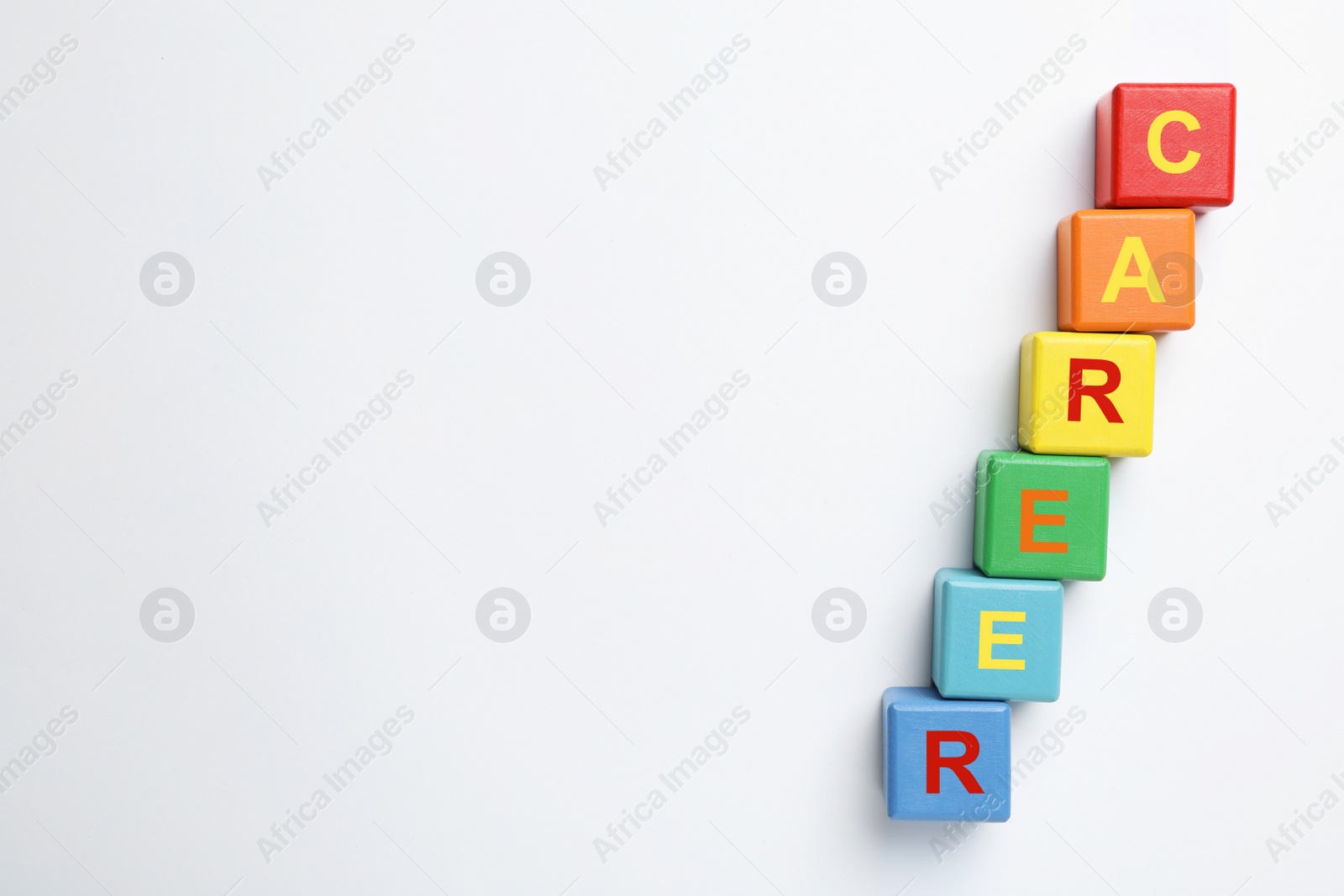 Photo of Colorful cubes with word CAREER on white background, top view. Space for text