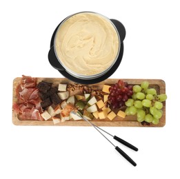 Fondue with tasty melted cheese, forks and different snacks isolated on white, top view