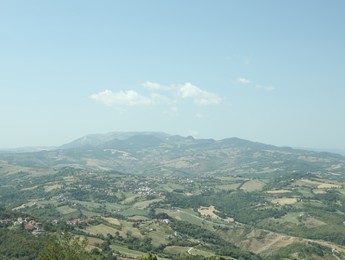 Photo of Aerial view of countryside and mountains on sunny day