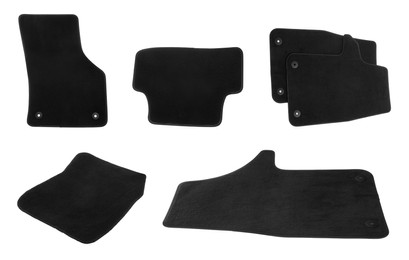 Set with black car floor mats on white background