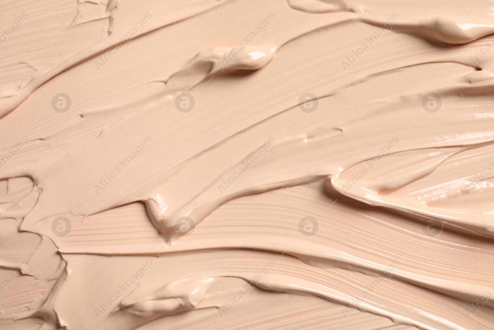 Photo of Texture of skin foundation as background, closeup