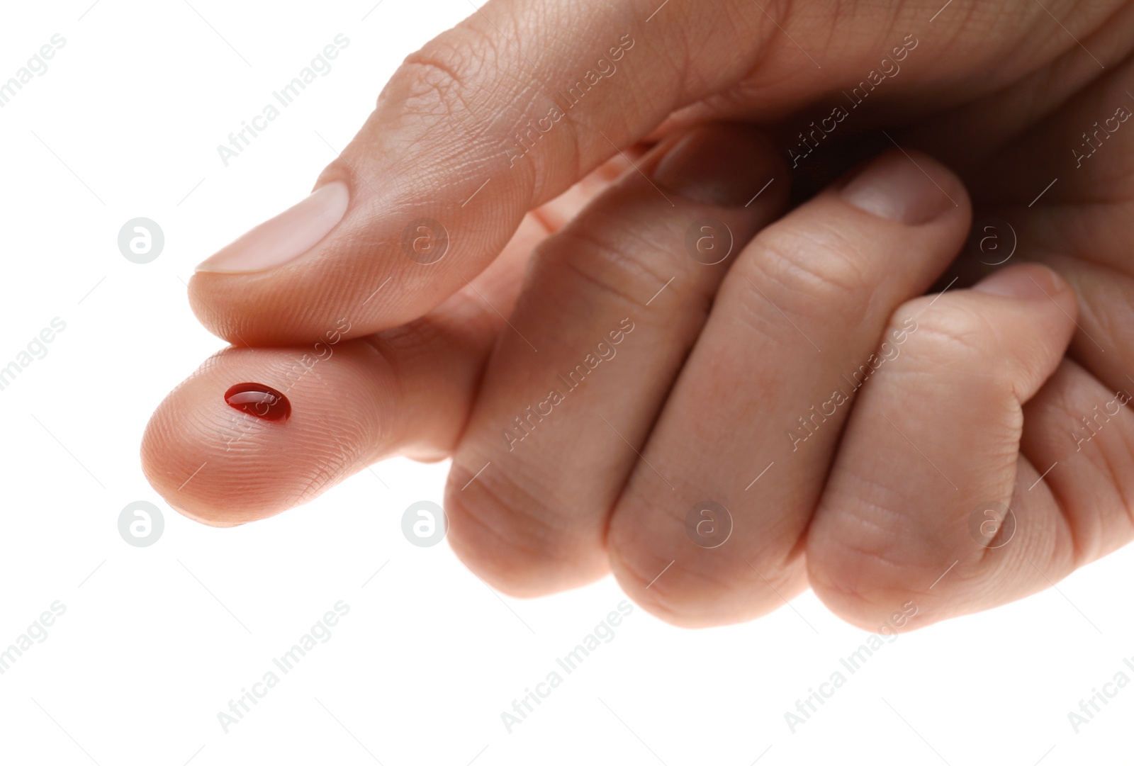 Photo of Woman with pricked finger and blood drop on white background, closeup